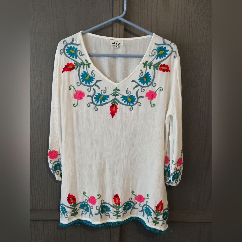 Embroidered White Top with Floral Accents